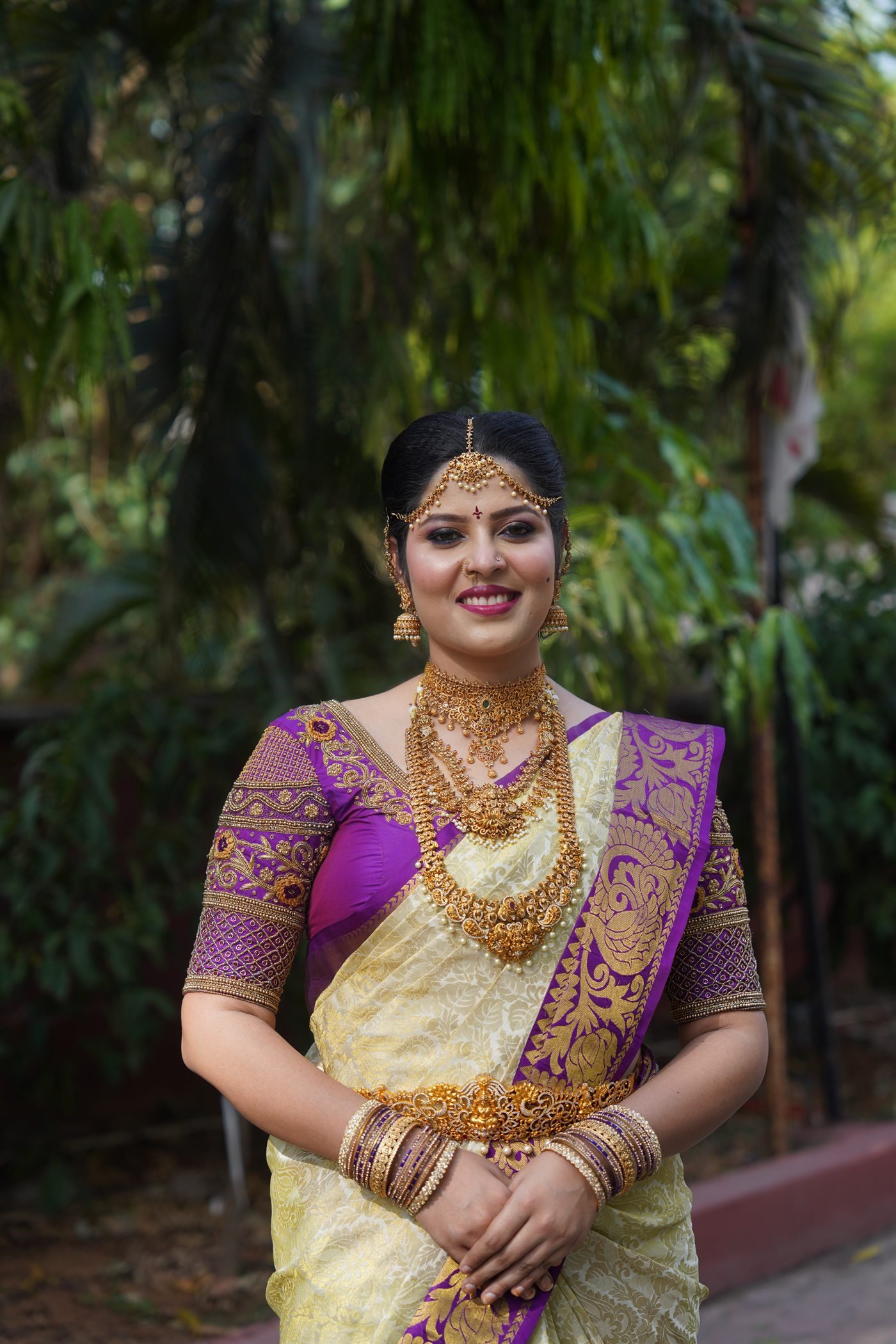 Traditional purple and gold bridal makeup look