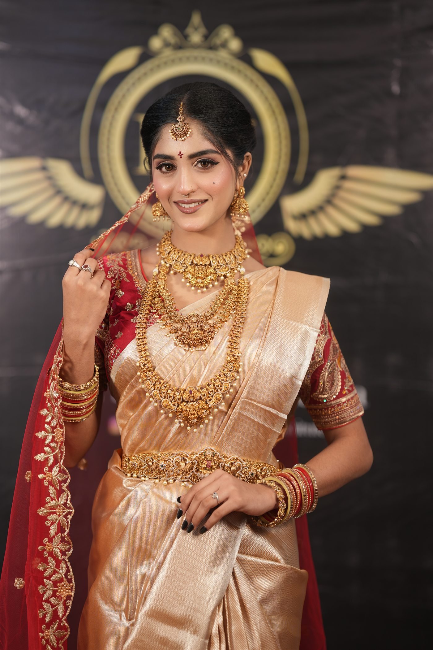 Professional red and gold bridal makeup look
