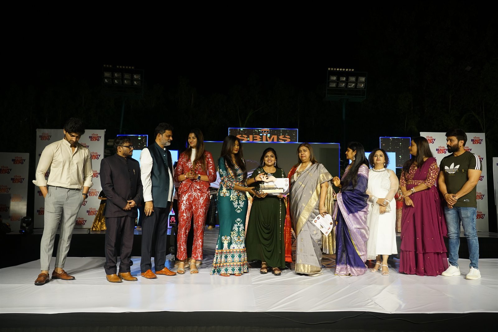 HV Angels trainer receiving recognition at the South India Beauty Expo